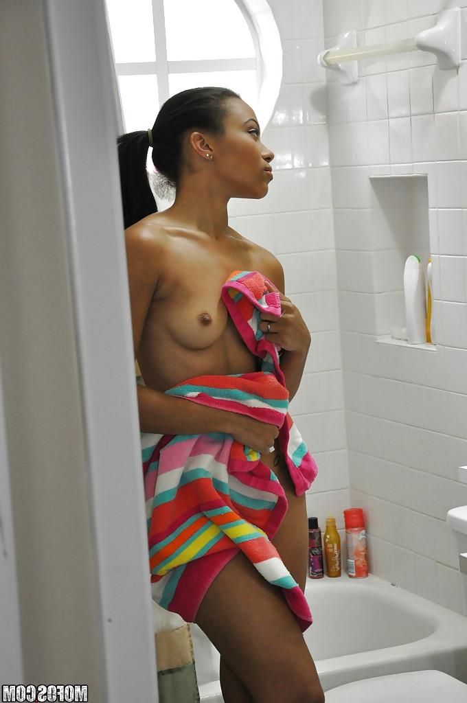 16P Ebony Adrian Maya undressing and taking shower in voyeur scene
