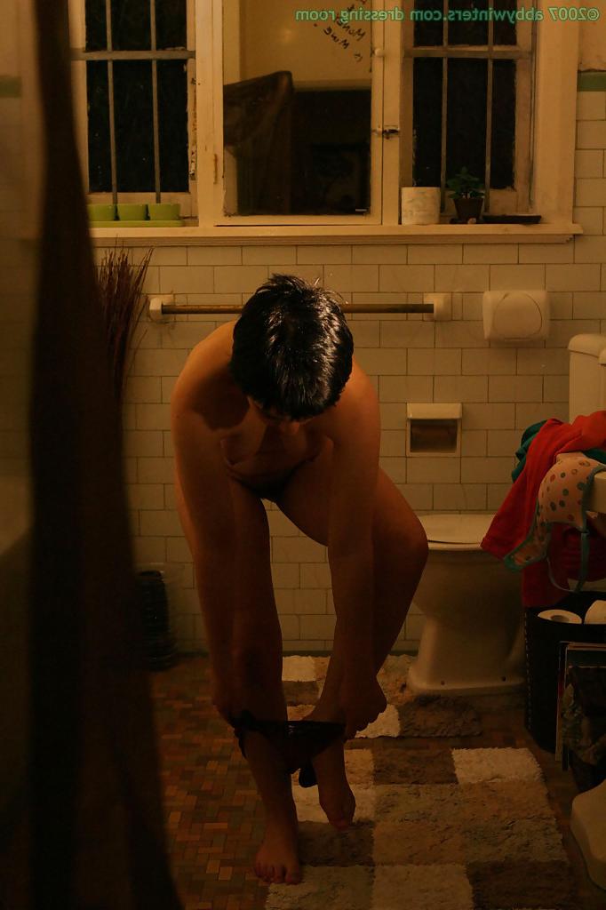 16P Hidden camera films short haired girl getting dressed after taking bath