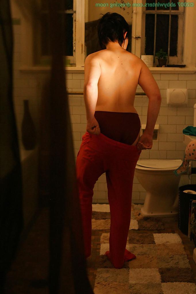 16P Hidden camera films short haired girl getting dressed after taking bath