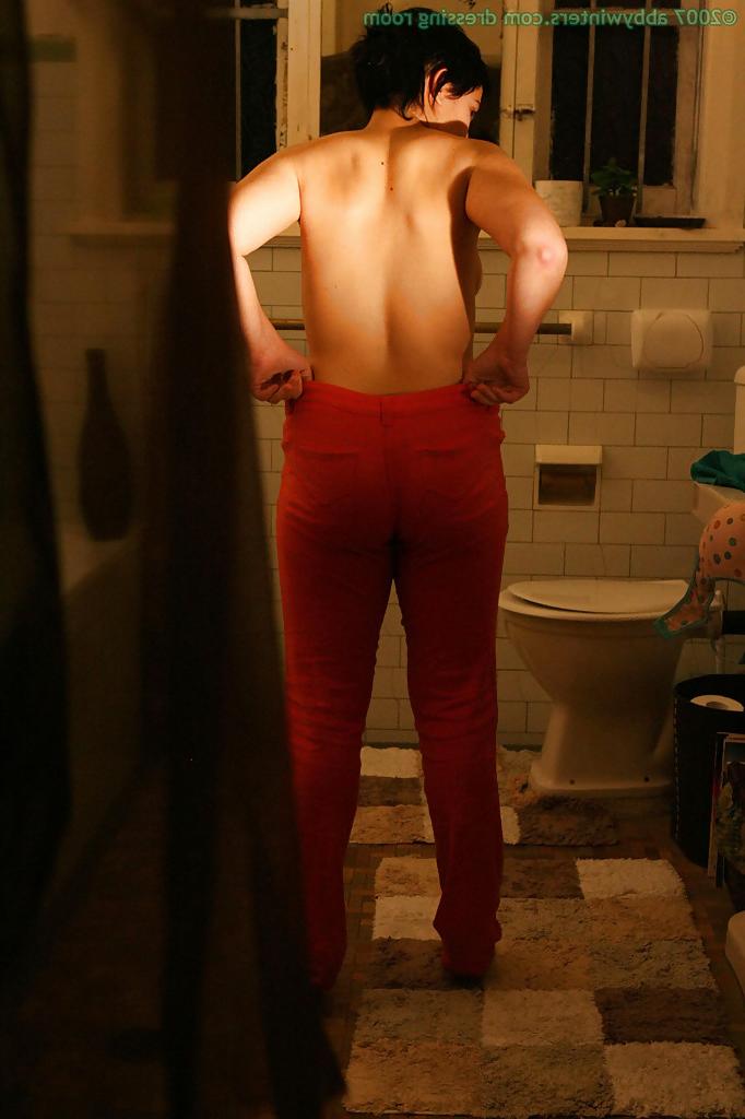 16P Hidden camera films short haired girl getting dressed after taking bath