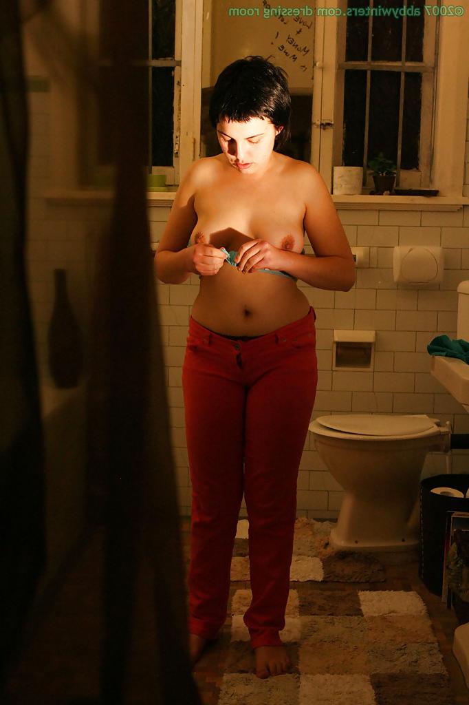 16P Hidden camera films short haired girl getting dressed after taking bath