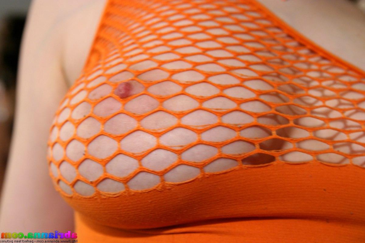 20P Pictures of Abrianna showing off her big tits in a mesh shirt