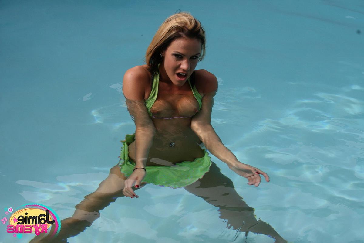 12P Hot teen Jamie Ryans flashes her perky tits while at the pool in her bikini