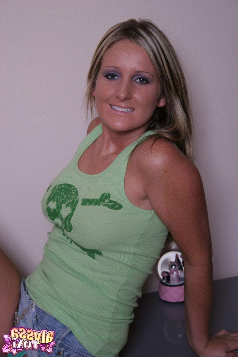 20P Pictures of teen Alyssa Roxi stripping for fun in the living room