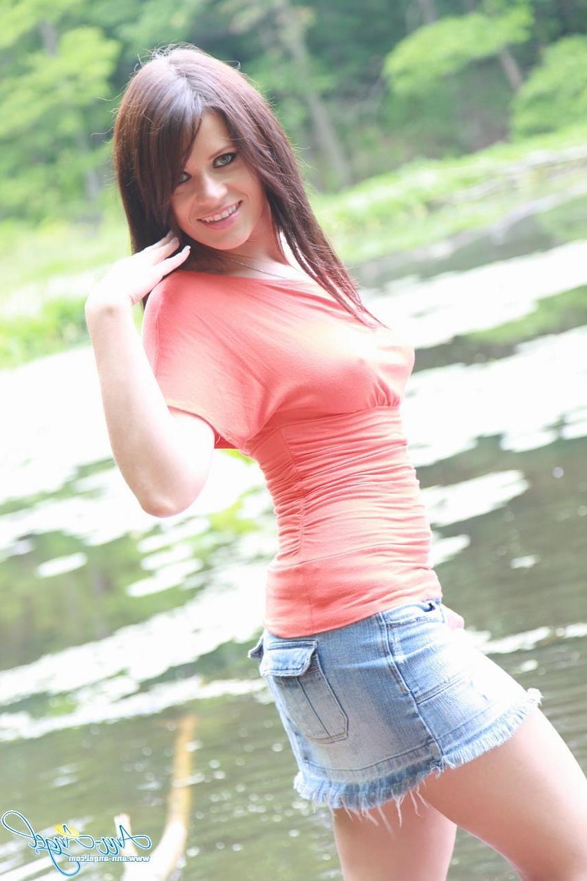 15P Pictures of brunette teen Ann Angel showing you up her skirt outside