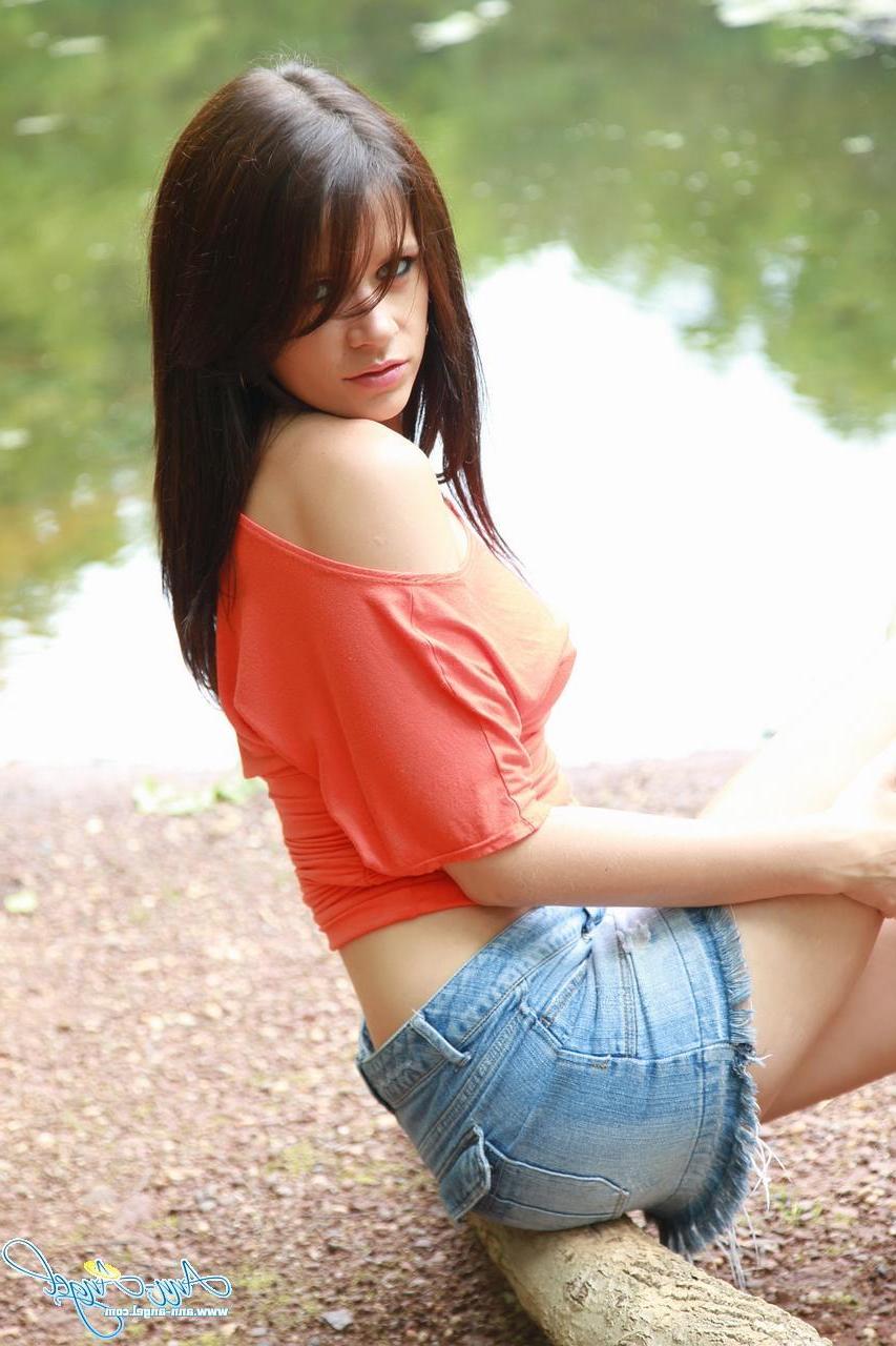 15P Pictures of brunette teen Ann Angel showing you up her skirt outside