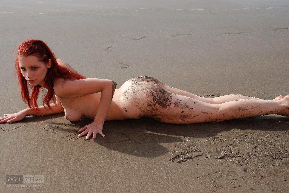 16P Pictures of teen girl Ariel rolling around on a beach