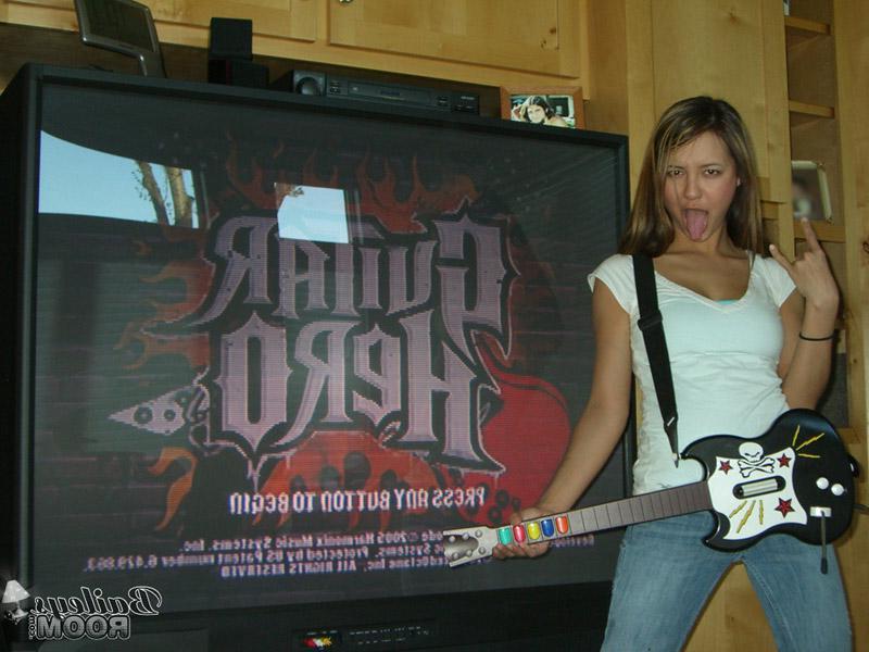 16P Pictures of Bailey jamming on a toy guitar