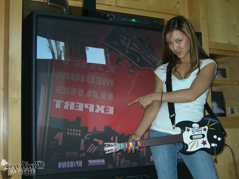 16P Pictures of Bailey jamming on a toy guitar