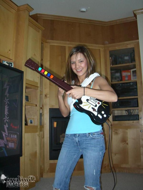 16P Pictures of Bailey jamming on a toy guitar