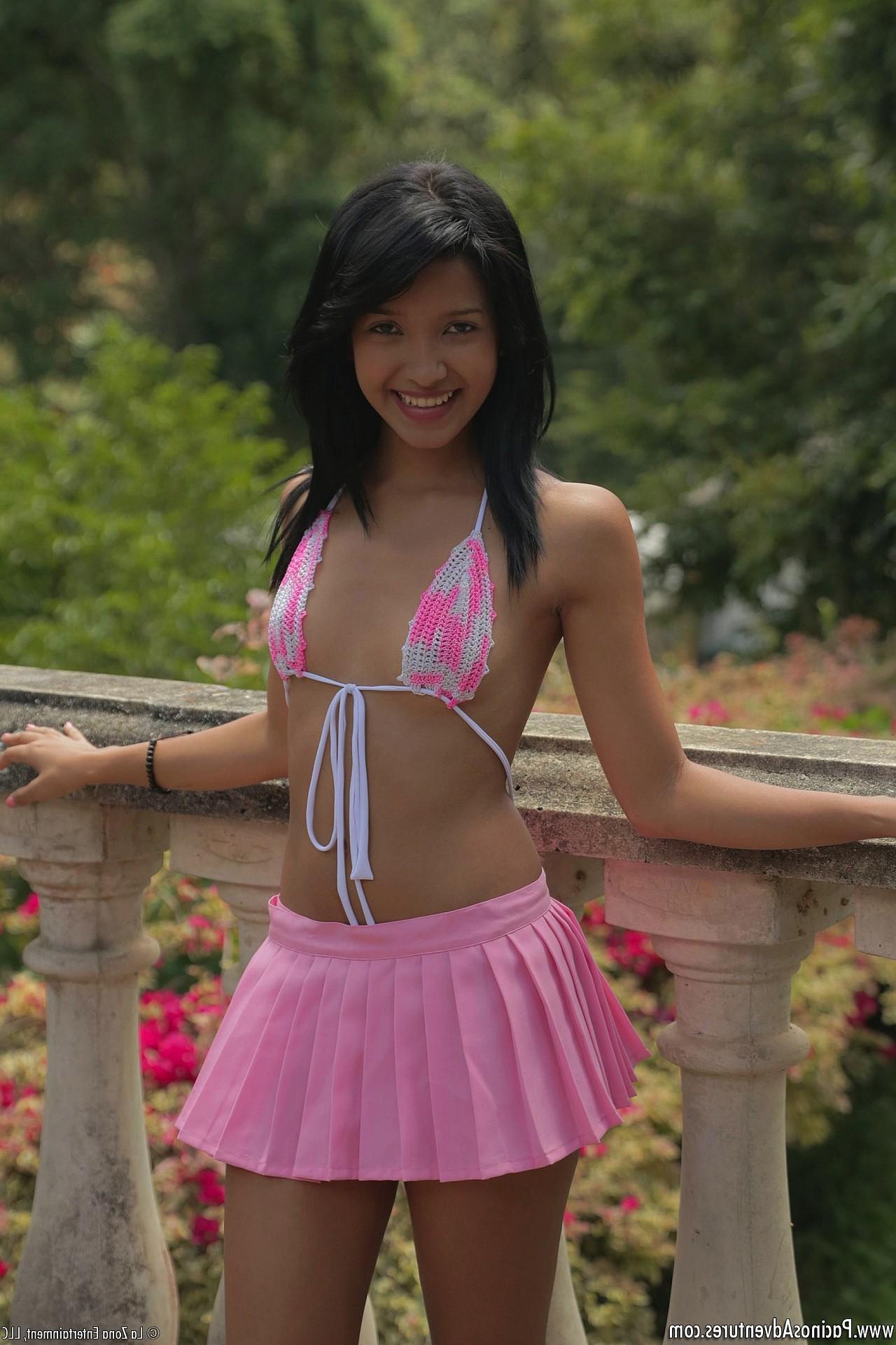 13P Carol Lopez wears a string bikini and a pink mini skirt and shakes that latina teen body