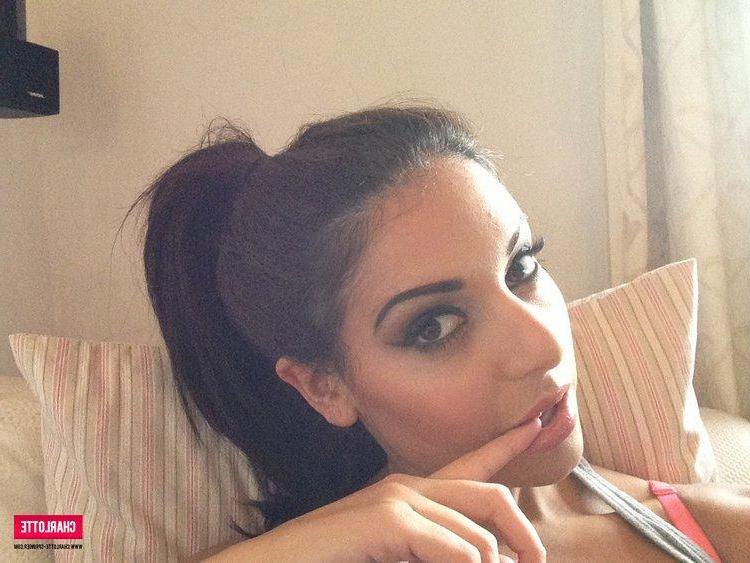 12P Brunette model Charlotte strips from her frilly bra