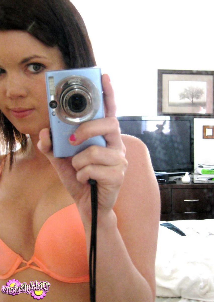 12P Diddy takes self pictures of herself in a bright orange bra