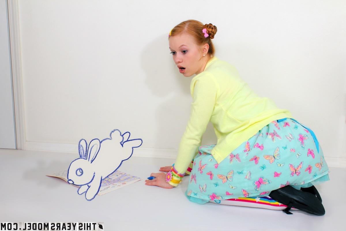 15P Redhead teen Dolly Little has some naked fun