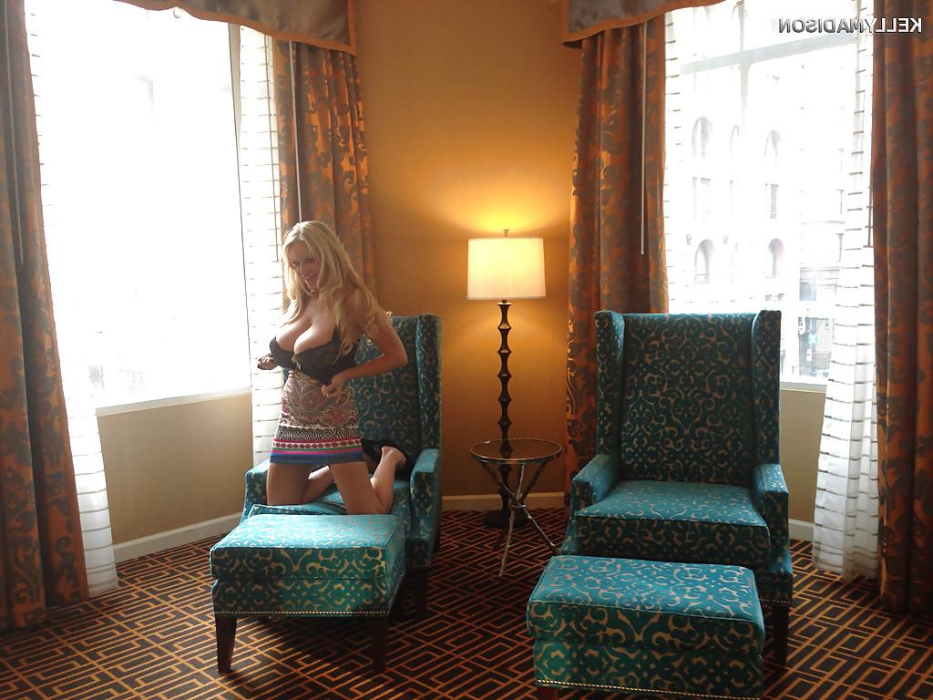 16P Kelly Madison is demonstrating her mature big tits in a skirt