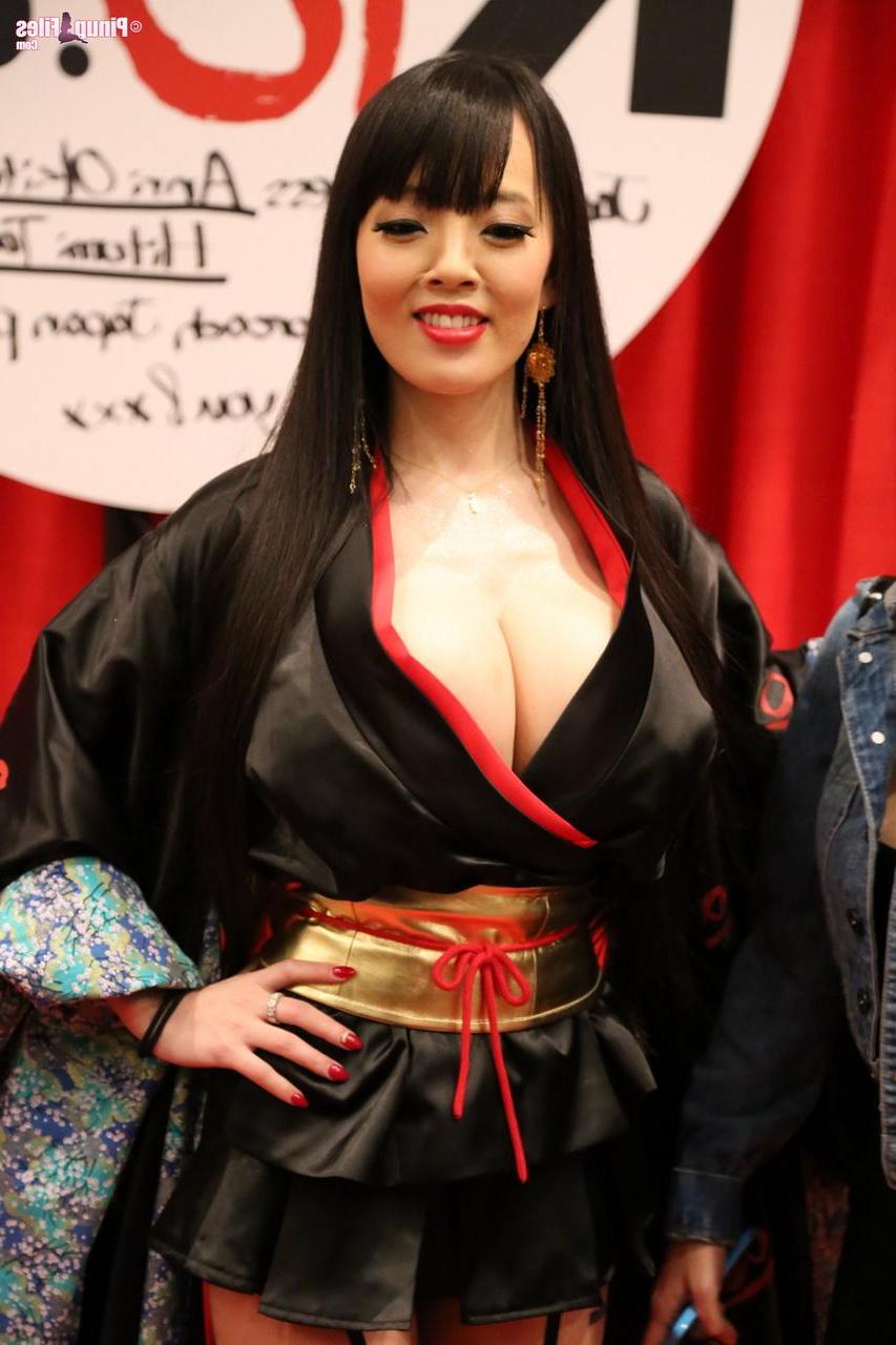 15P Busty asian pinup Hitomi Tanaka teases with her massive jugs