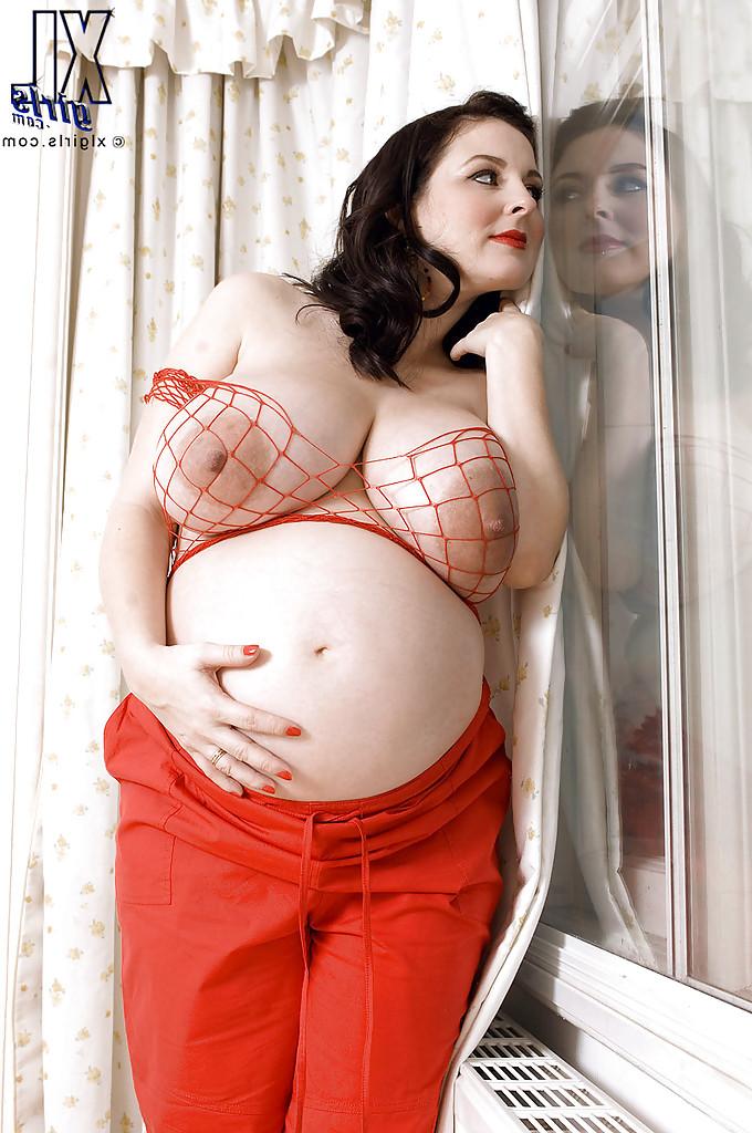 16P Brunette preggo with fat tits Lorna Morgan posing in fishnet bra and black panties