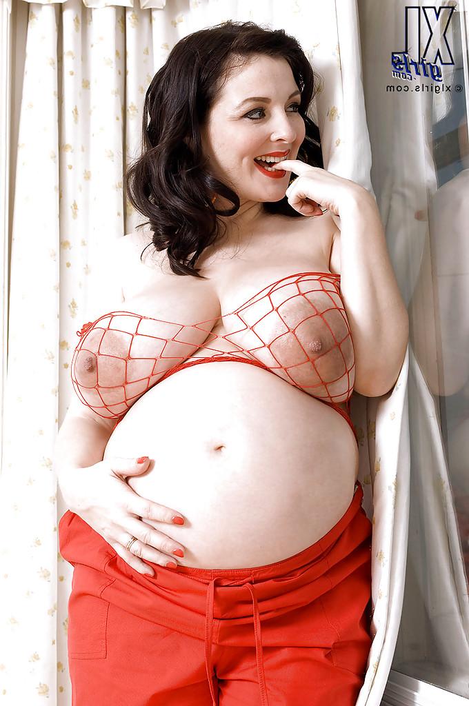 16P Brunette preggo with fat tits Lorna Morgan posing in fishnet bra and black panties