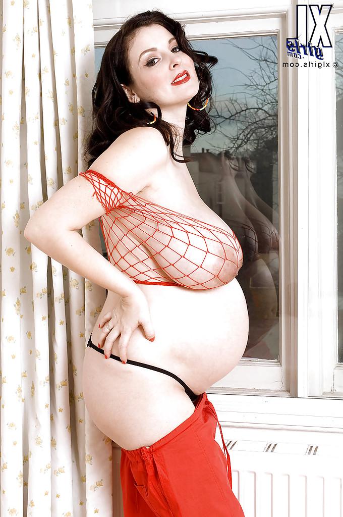 16P Brunette preggo with fat tits Lorna Morgan posing in fishnet bra and black panties