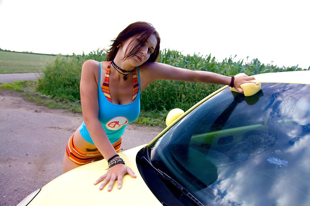 16P Busty babe in bikini Roxy strips and flaunts naked near her car