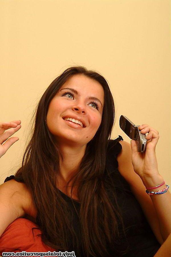 20P Pictures of teen girl Judy playing with her cellphone and pussy