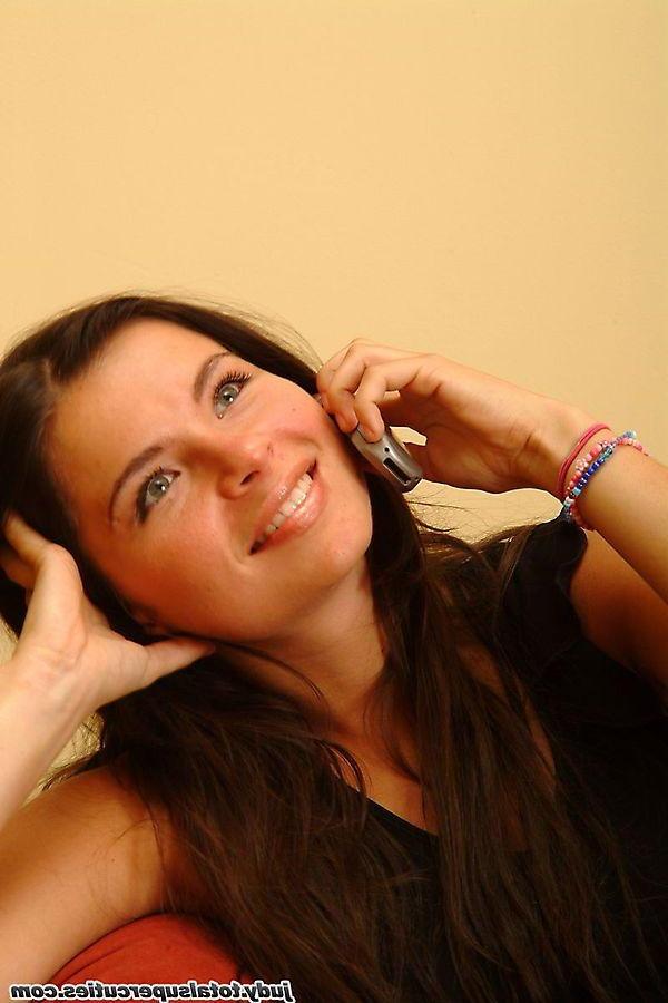 20P Pictures of teen girl Judy playing with her cellphone and pussy
