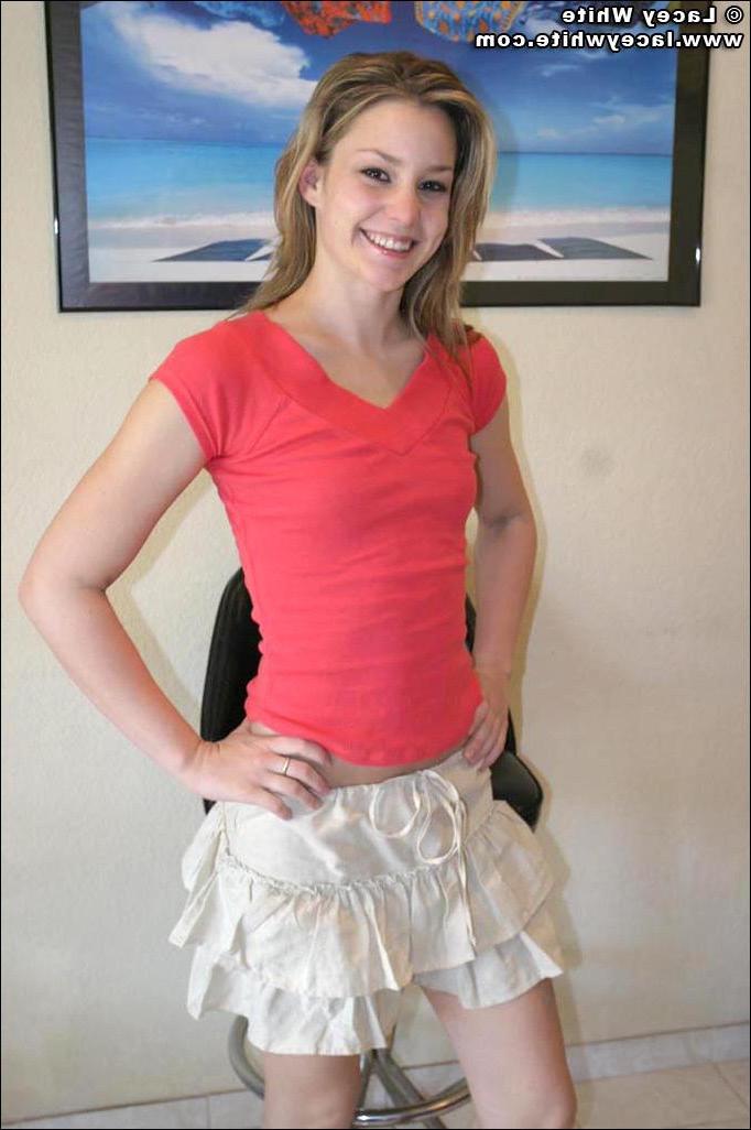 20P Pics of teen chick Lacey White showing off in her living room
