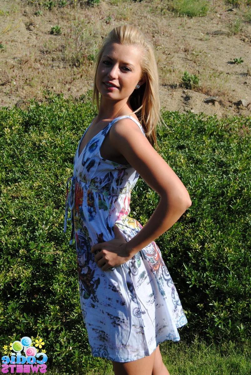12P Blonde tease Codie Sweets shows off her perfect round ass outside in the backyard