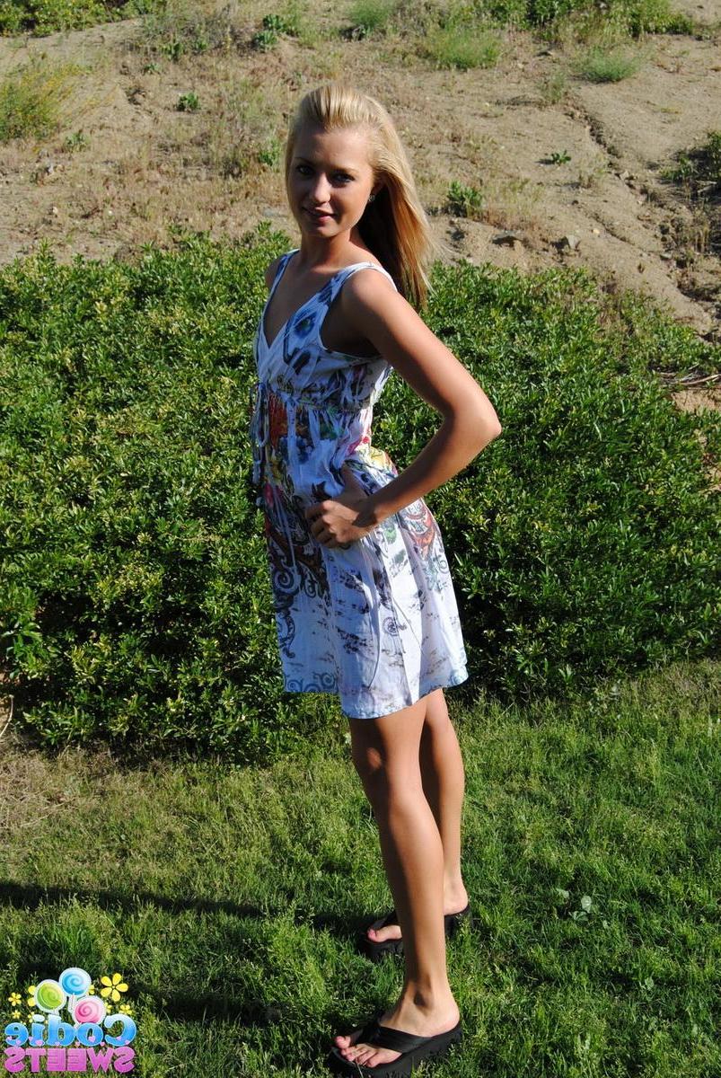 12P Blonde tease Codie Sweets shows off her perfect round ass outside in the backyard