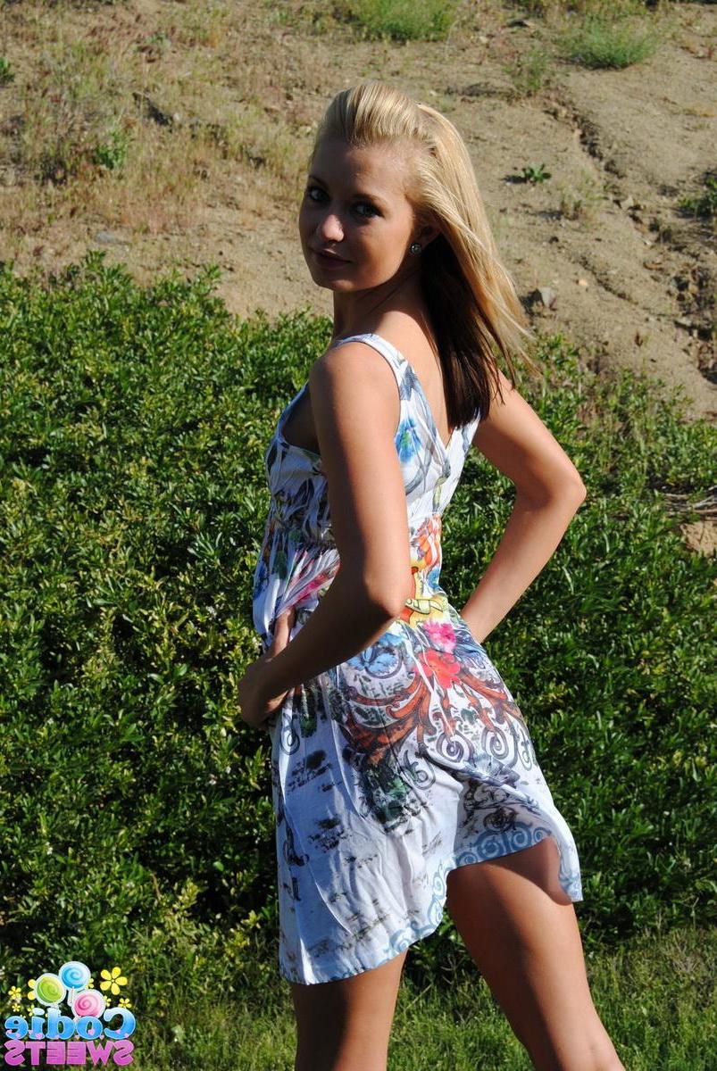 12P Blonde tease Codie Sweets shows off her perfect round ass outside in the backyard