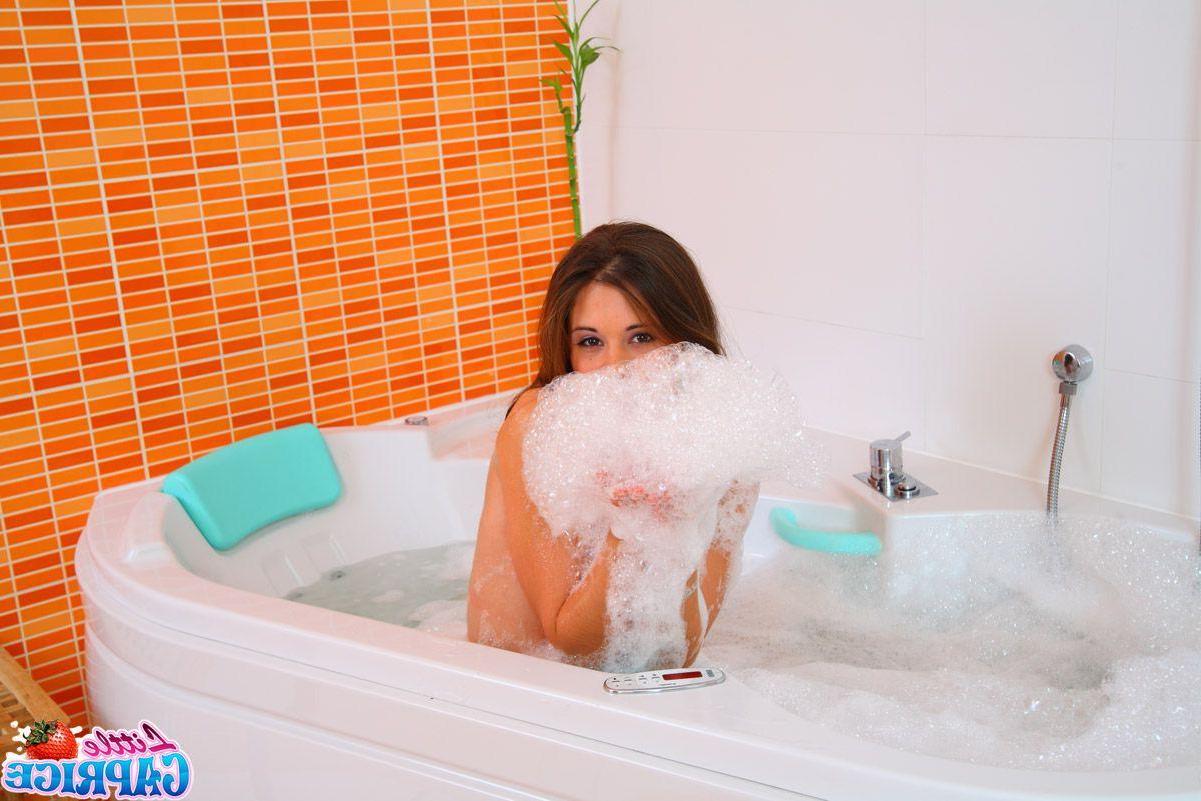 15P Pictures of Little Caprice playing with her pussy in the bath