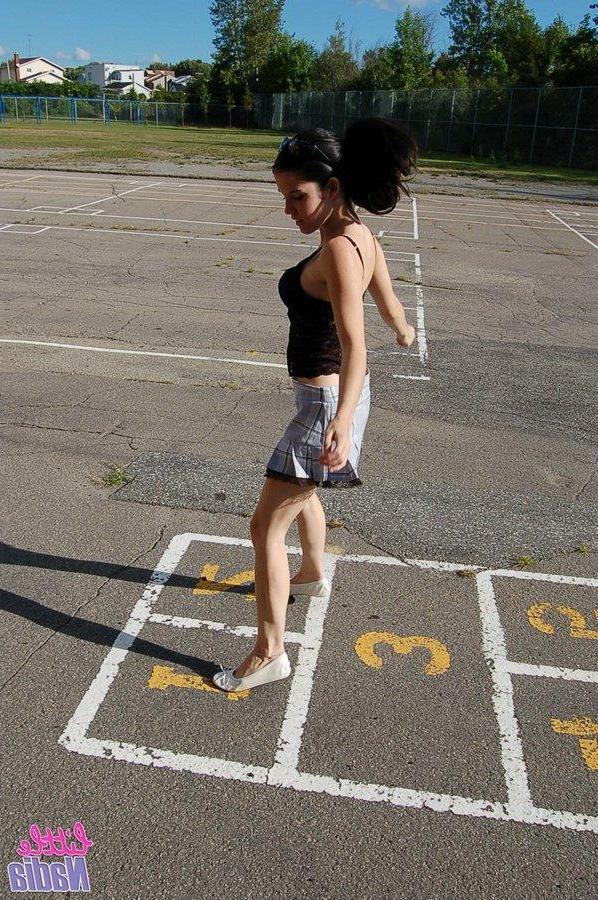 15P Pictures of teen girl Little Nadia showing off her hot ass outside