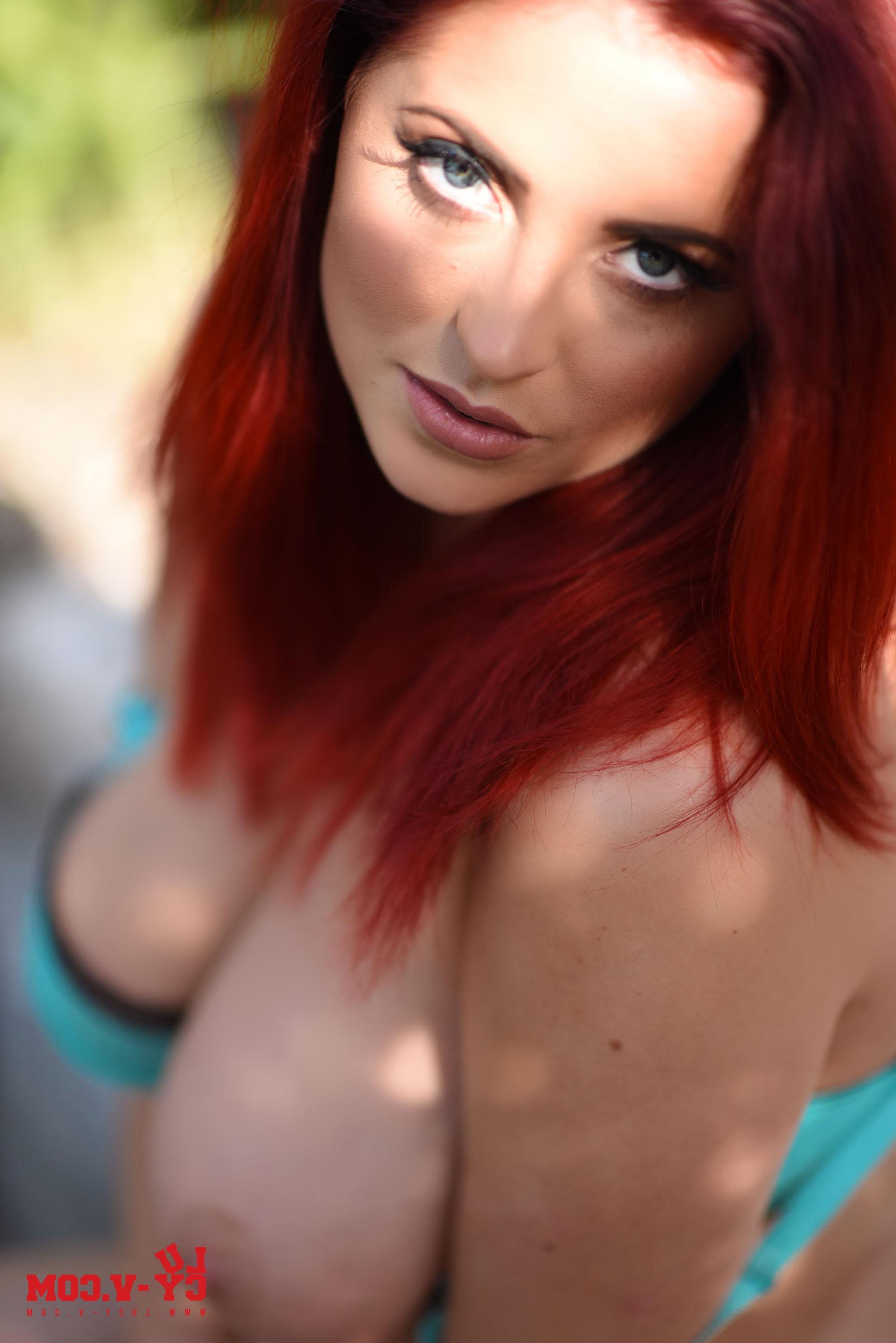 16P Redhead babe Lucy V shows off her awesome boobs outside