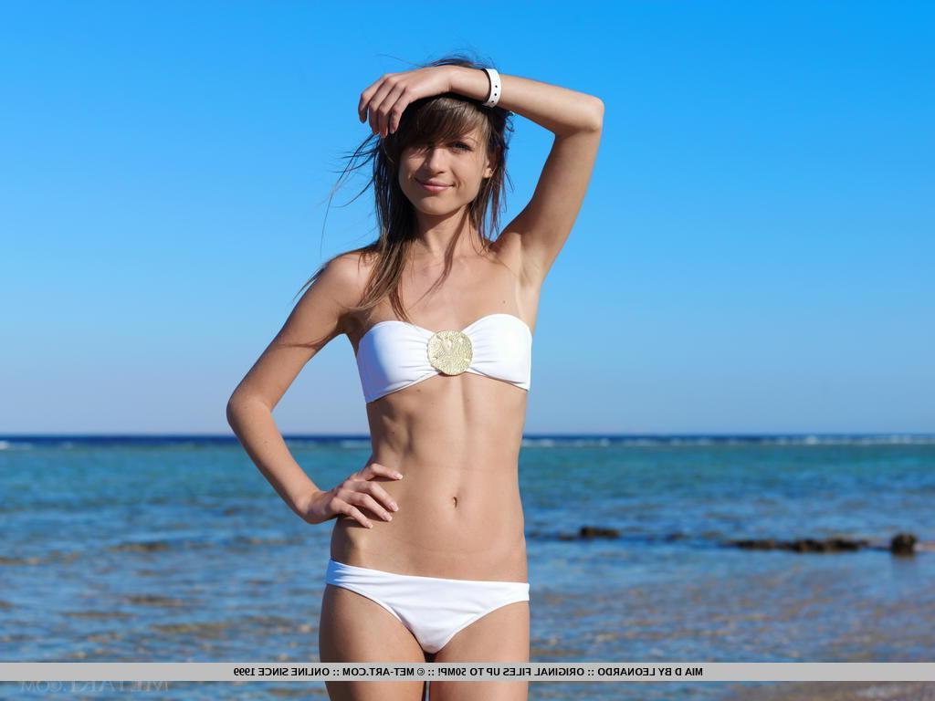 18P Teen model Mia D strips off her white bikini at the beach
