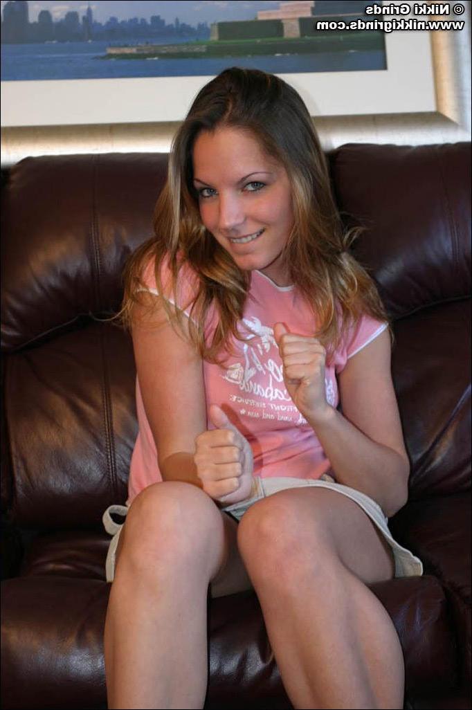 20P Pics of teen babe Nikki Grinds flashing her boobs in the living room