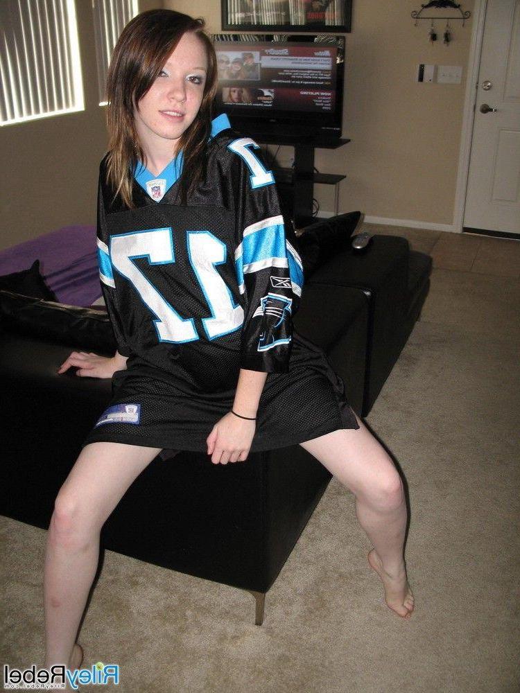 20P Pictures of teen Riley Rebel stripping totally nude in the living room
