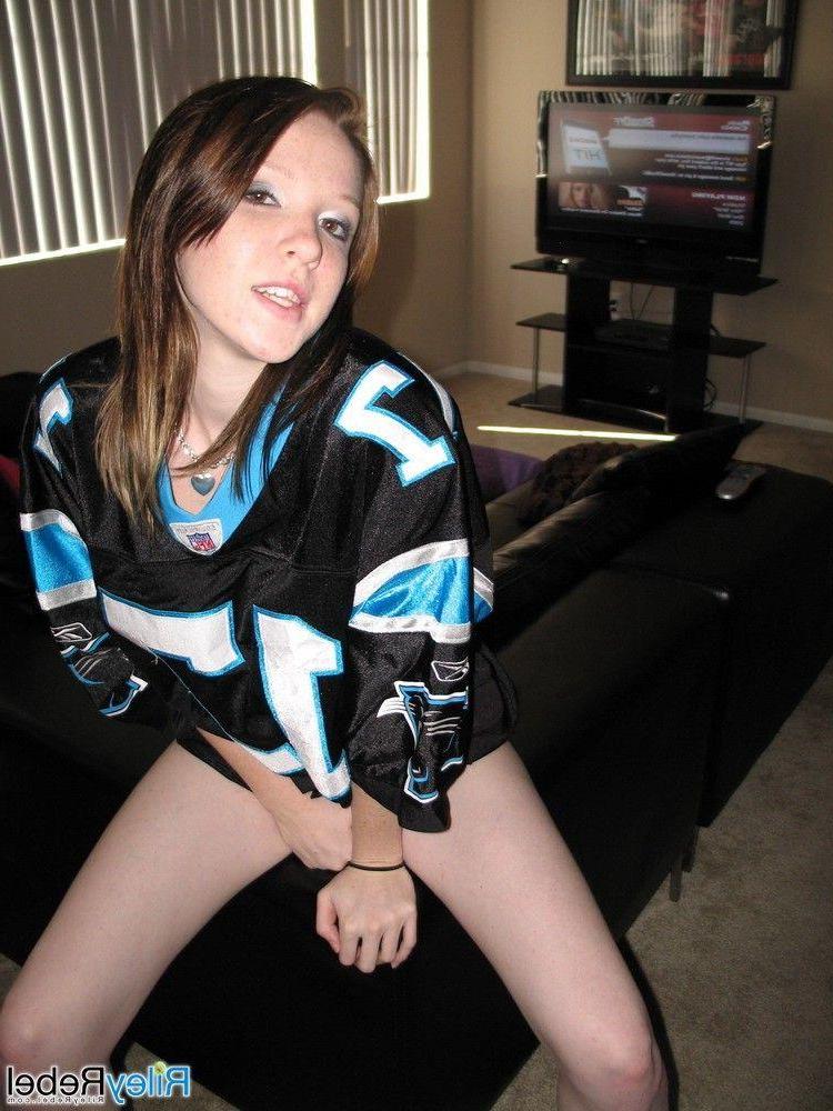 20P Pictures of teen Riley Rebel stripping totally nude in the living room