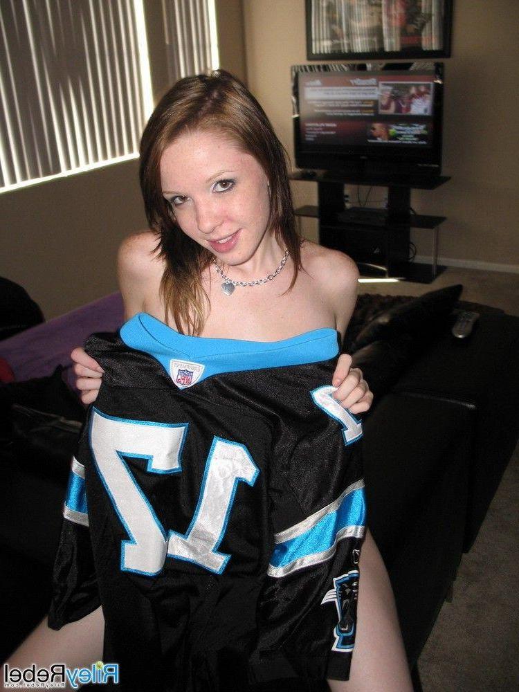 20P Pictures of teen Riley Rebel stripping totally nude in the living room