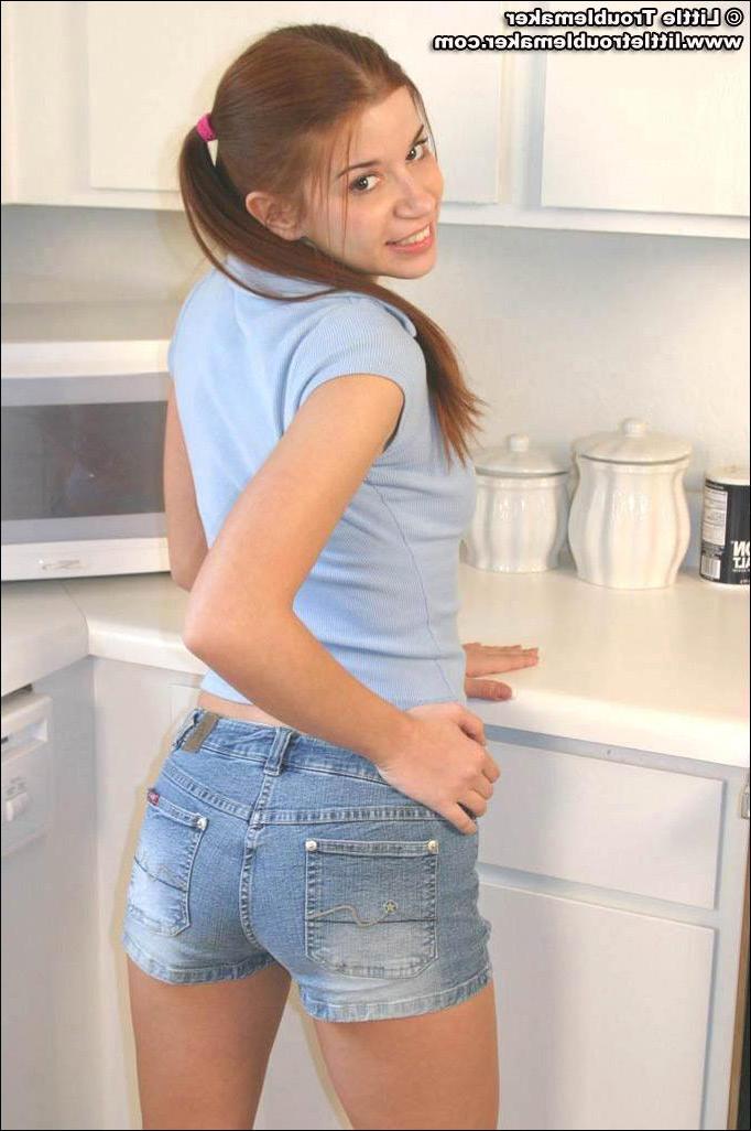 20P Pictures of teen girl Little Troublemaker showing off her tits in the kitchen
