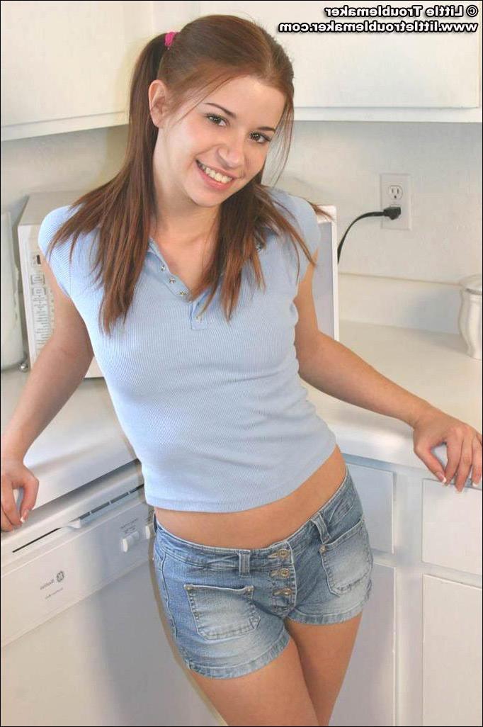 20P Pictures of teen girl Little Troublemaker showing off her tits in the kitchen
