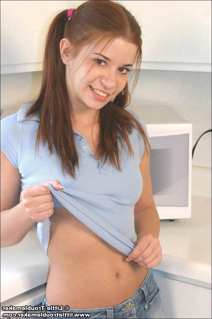 20P Pictures of teen girl Little Troublemaker showing off her tits in the kitchen