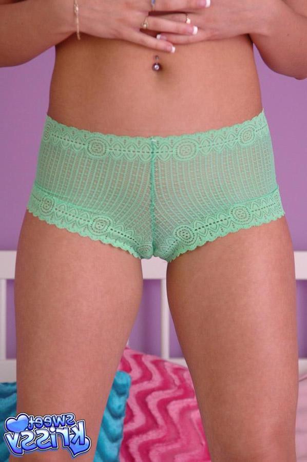 12P Brunette babe Sweet Krissy is popping out of her green bra