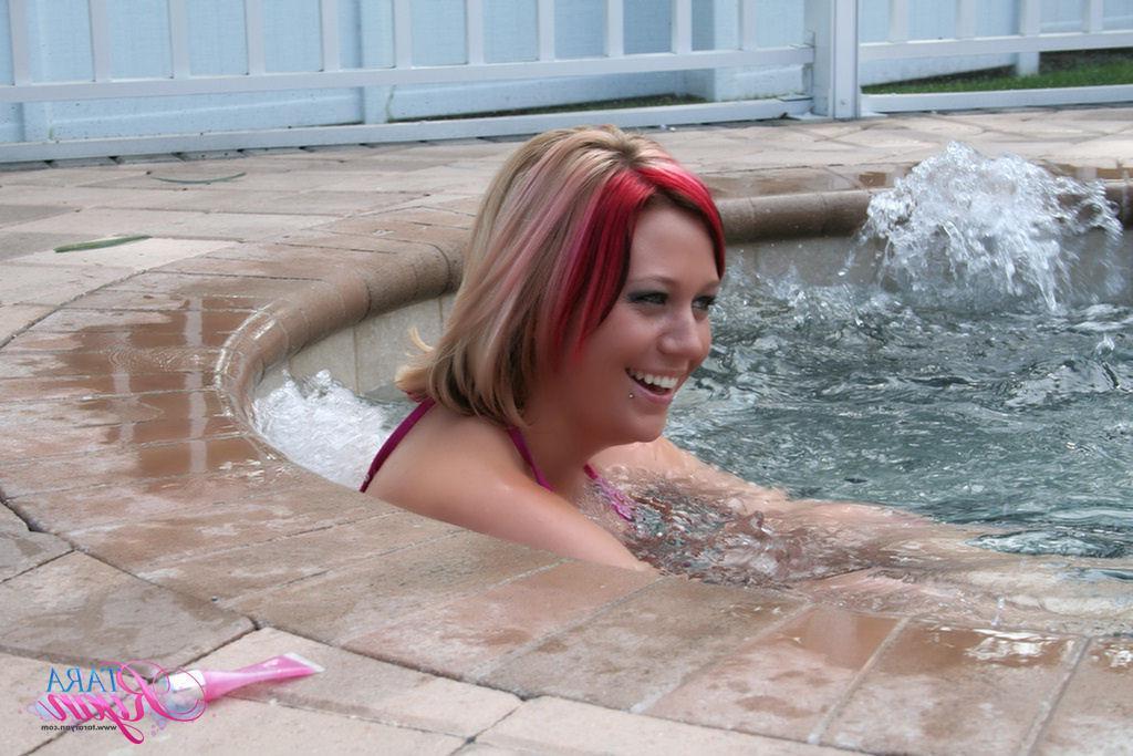 20P Pictures of teen babe Tara Ryan going for a nude dip in the hot tube