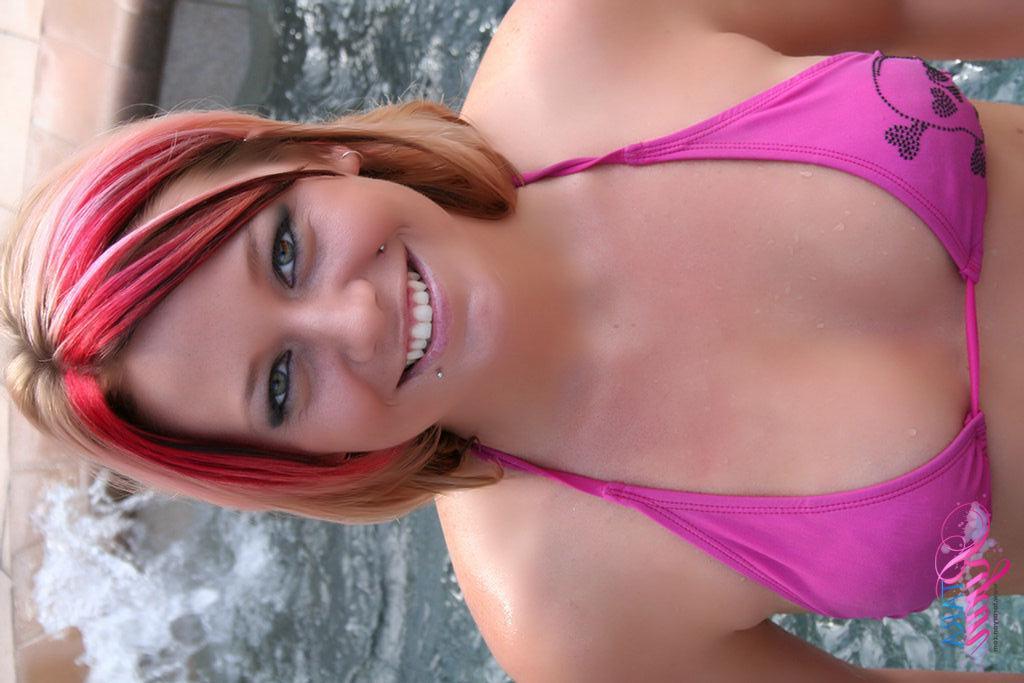20P Pictures of teen babe Tara Ryan going for a nude dip in the hot tube
