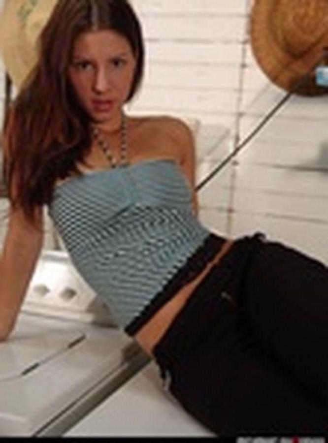 20P Pictures of teen cutie Tara getting naked in the laundry room