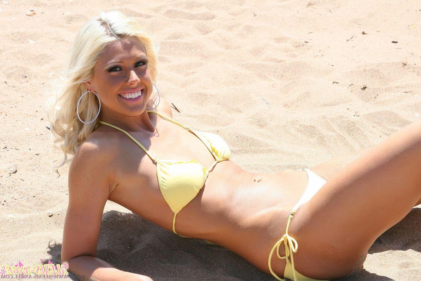 16P Pictures of teen star Alexis Angel catching some rays on a beach