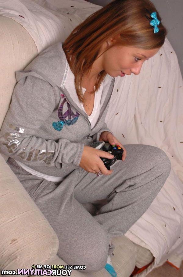 15P Pictures of teen hottie Your Caitlynn playing some video games