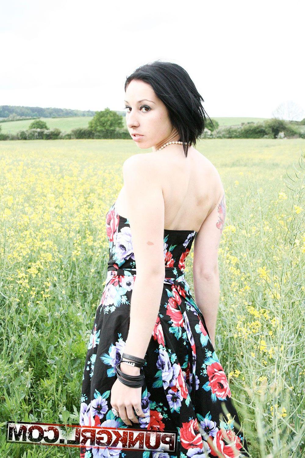 20P Pictures of teen babe Tarrie Noir getting naked outside