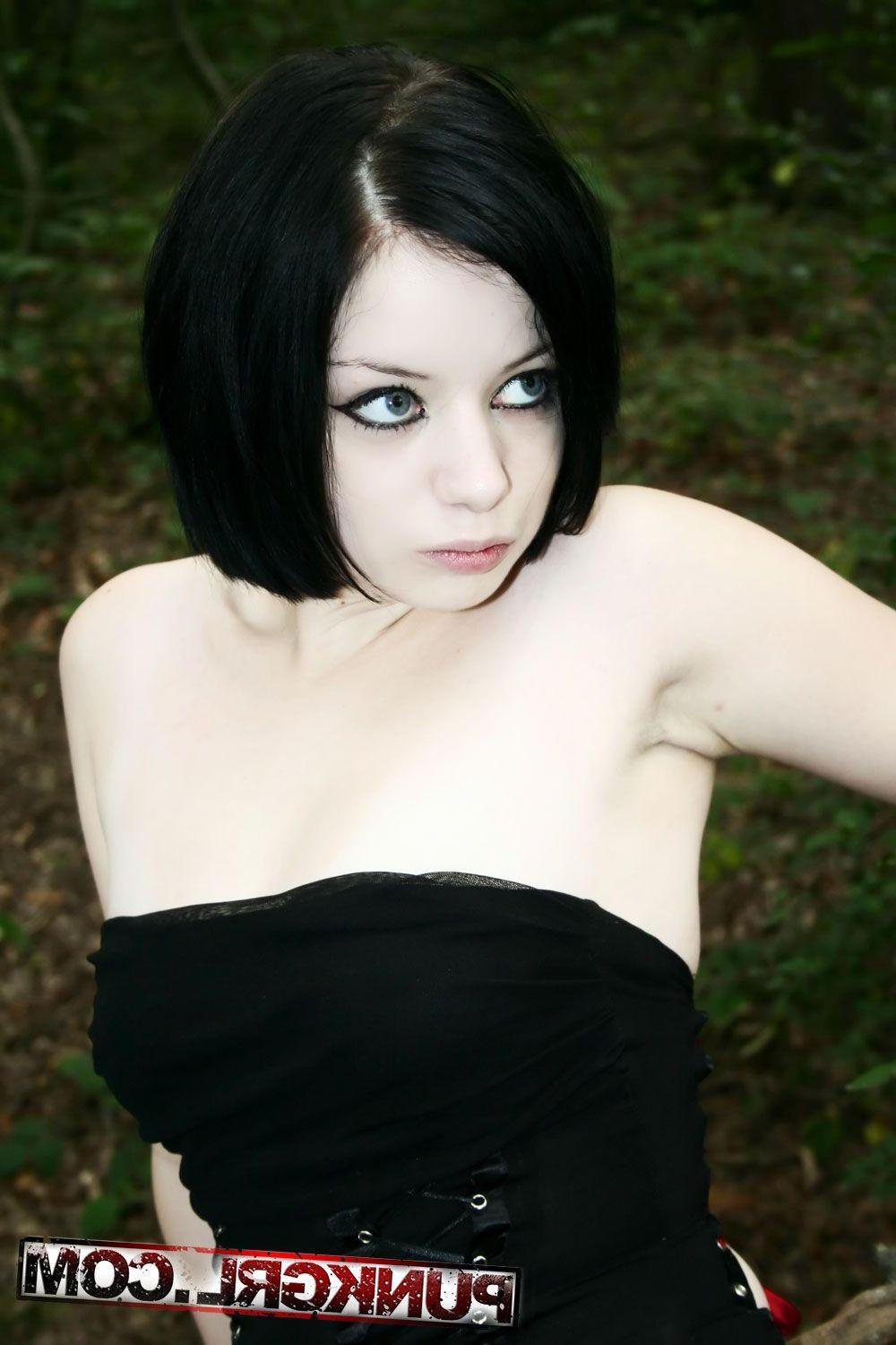 20P Pictures of teen girl Toxica showing off her titties in the woods
