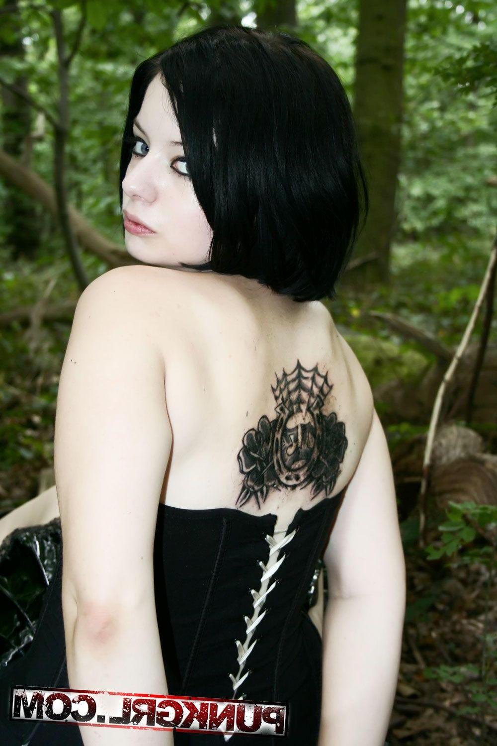 20P Pictures of teen girl Toxica showing off her titties in the woods